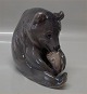 Royal Copenhagen figurine 0351 - 1233 RC Bear chewing toe, Erik Nielsen 1901 16 
cm, brown
